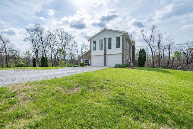 2130 E 163, Columbia, MO 65201 - view of home's exterior featuring an attached garage, gravel driveway, and a yard
