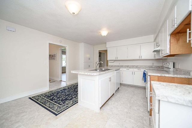 2130 E 163, Columbia, MO 65201 - kitchen featuring white dishwasher, electric stove, an island with sink, white cabinets, and under cabinet range hood