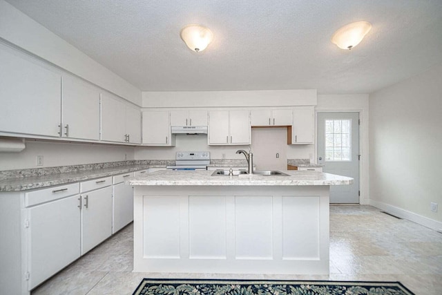2130 E 163, Columbia, MO 65201 - kitchen featuring electric stove, under cabinet range hood, light countertops, a kitchen island with sink, and a textured ceiling