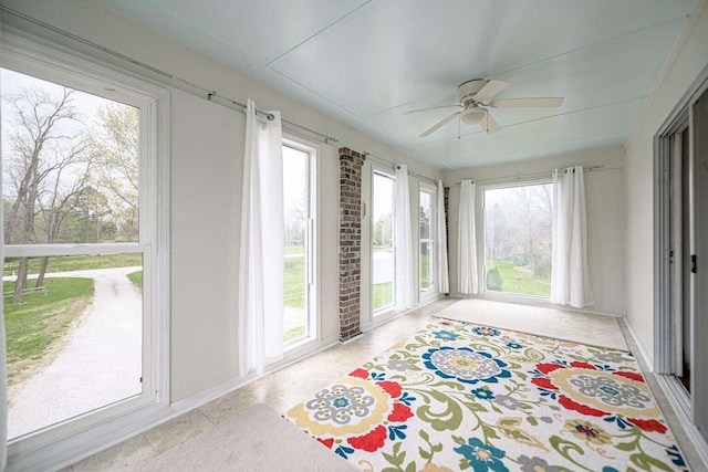 2130 E 163, Columbia, MO 65201 - unfurnished sunroom featuring tile patterned flooring and baseboards