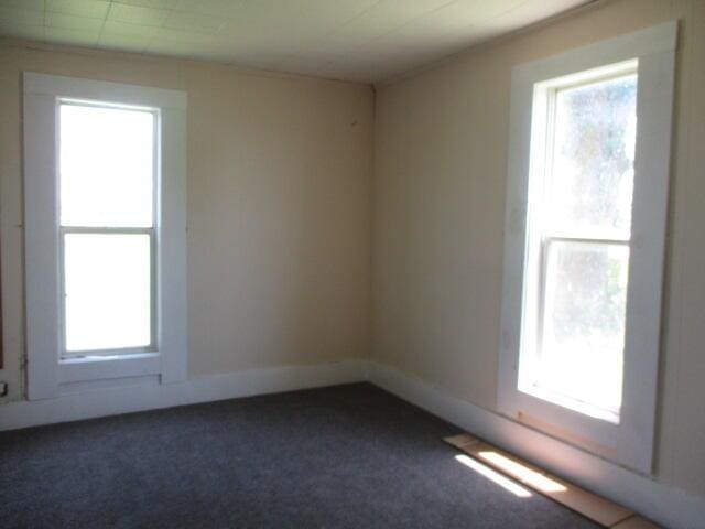 17750 N Rte Z, Centralia, MO 65240 - unfurnished room with plenty of natural light and dark colored carpet