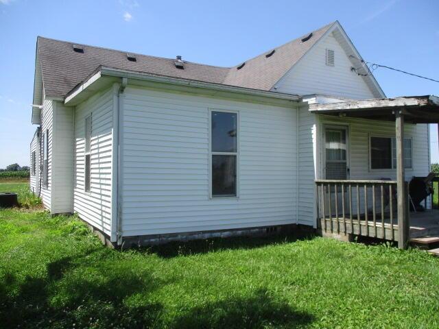 17750 N Rte Z, Centralia, MO 65240 - back of property featuring a lawn, a deck, and roof with shingles