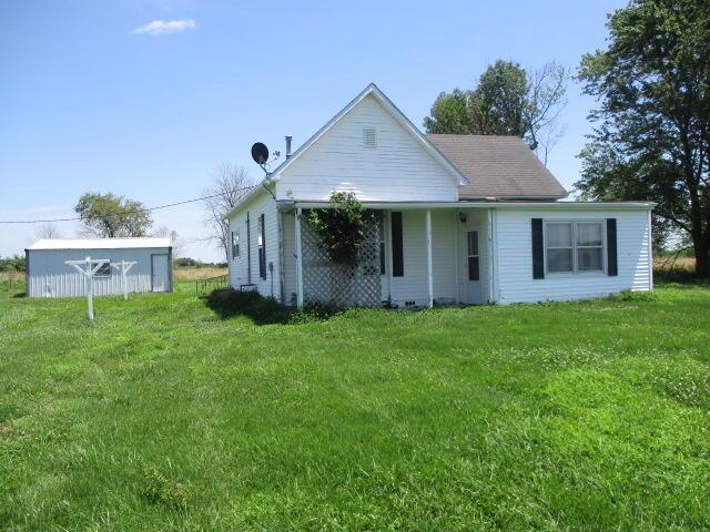 17750 N Rte Z, Centralia, MO 65240 - rear view of property featuring a lawn and an outbuilding