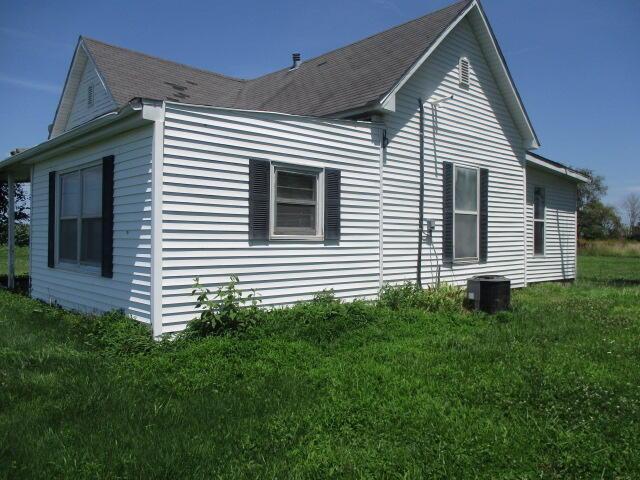 17750 N Rte Z, Centralia, MO 65240 - view of side of property featuring a yard and a shingled roof