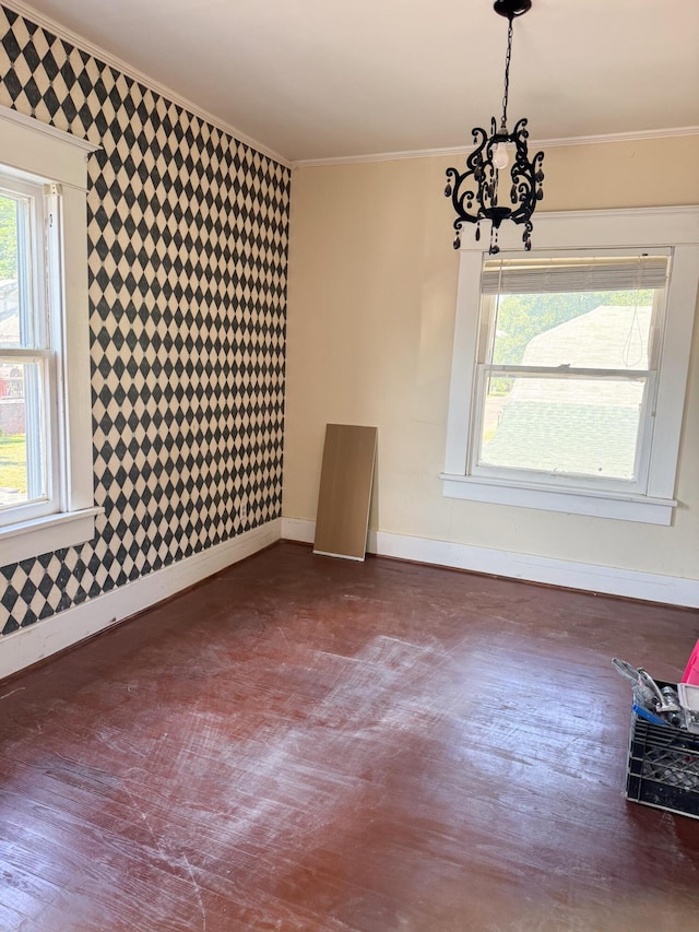 632 W Logan St, Moberly, MO 65270 - empty room featuring crown molding and a chandelier