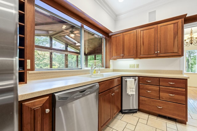 450 W Covered Bridge Rd, Columbia, MO 65203 - kitchen with appliances with stainless steel finishes, ornamental molding, light countertops, brown cabinetry, and a chandelier
