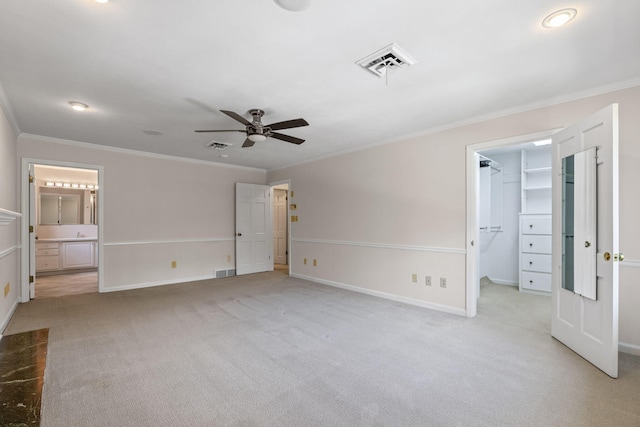 450 W Covered Bridge Rd, Columbia, MO 65203 - unfurnished bedroom with light colored carpet, crown molding, a spacious closet, connected bathroom, and a ceiling fan