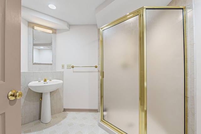 450 W Covered Bridge Rd, Columbia, MO 65203 - bathroom featuring tile walls, a stall shower, and tile patterned floors