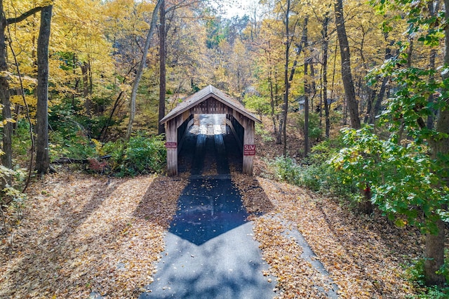 450 W Covered Bridge Rd, Columbia, MO 65203 - garage featuring a view of trees