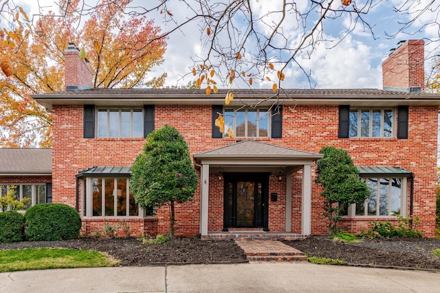 450 W Covered Bridge Rd, Columbia, MO 65203 - colonial inspired home with brick siding and a chimney