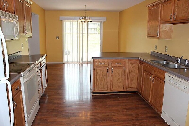 3107 Lake Town Dr, Columbia, MO 65203 - kitchen with white appliances, a peninsula, dark wood-type flooring, and a chandelier