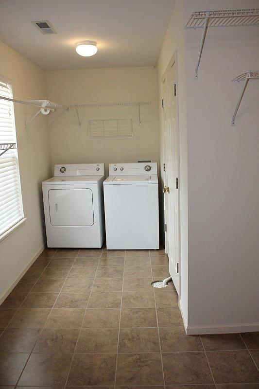 3107 Lake Town Dr, Columbia, MO 65203 - washroom featuring independent washer and dryer and tile patterned floors