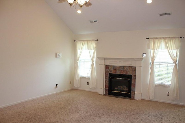 3107 Lake Town Dr, Columbia, MO 65203 - unfurnished living room featuring a tile fireplace, carpet flooring, a ceiling fan, and vaulted ceiling