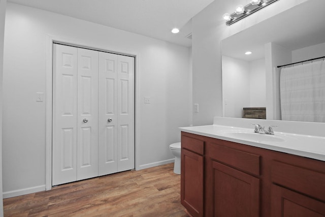 925 Kelli Ct, Centralia, MO 65240 - bathroom with a closet, vanity, wood finished floors, and recessed lighting