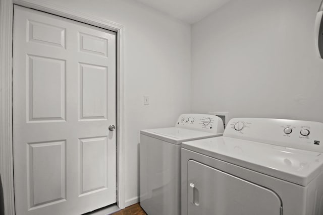 925 Kelli Ct, Centralia, MO 65240 - washroom with washer and dryer and dark wood-style floors