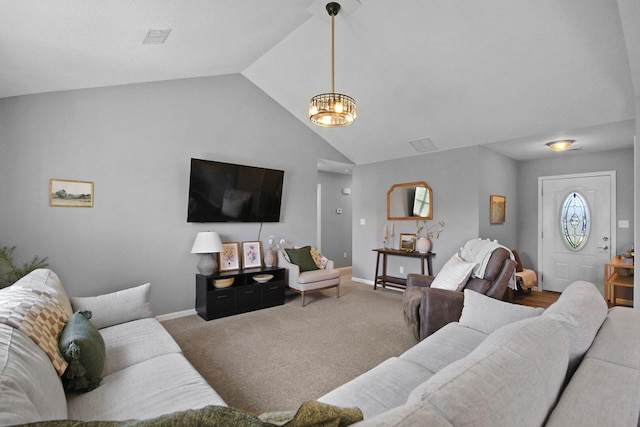 925 Kelli Ct, Centralia, MO 65240 - living area featuring lofted ceiling, a chandelier, and carpet floors