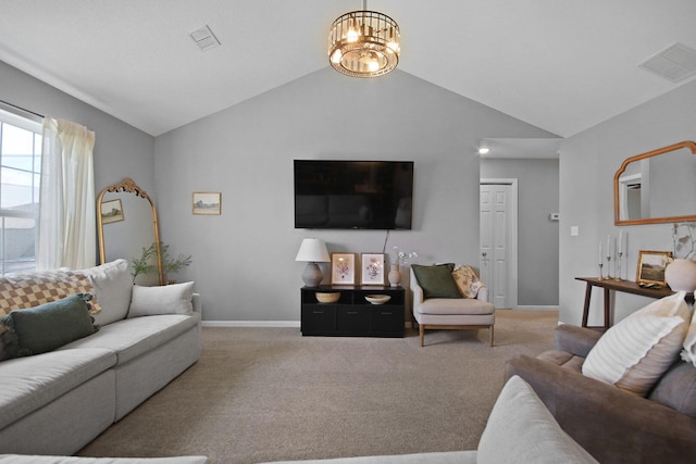 925 Kelli Ct, Centralia, MO 65240 - carpeted living area featuring lofted ceiling and a chandelier