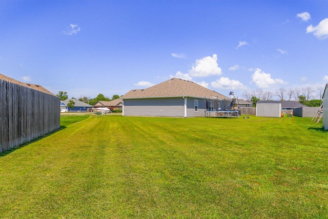 925 Kelli Ct, Centralia, MO 65240 - view of yard featuring a storage unit and a trampoline