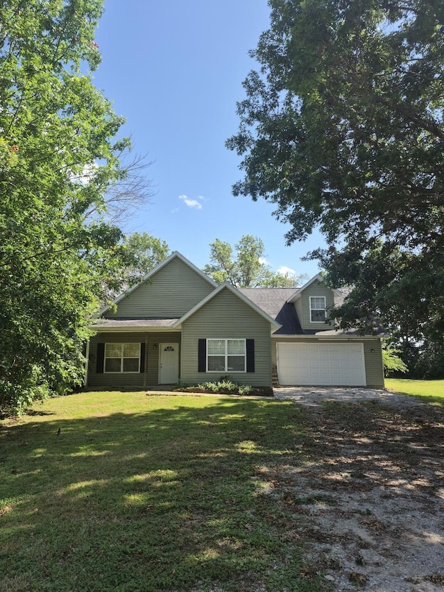 14640 N Sunnyslope, Hallsville, MO 65255 - view of front facade with dirt driveway, an attached garage, and a front yard