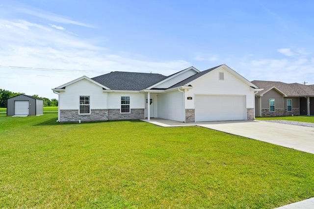 506 Addie Ln, Centralia, MO 65240 - view of front of house with driveway, stone siding, an attached garage, and a front yard