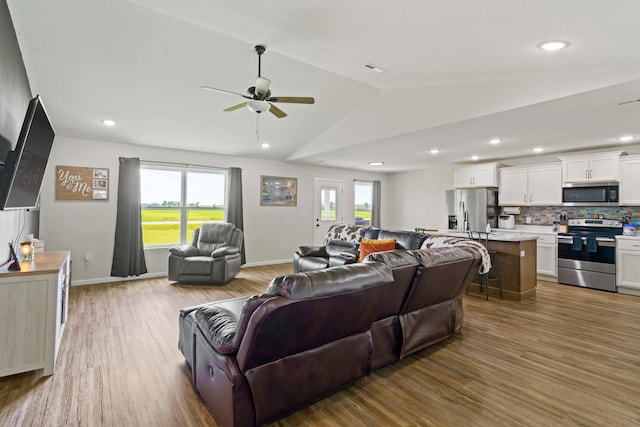 506 Addie Ln, Centralia, MO 65240 - living room with a ceiling fan, lofted ceiling, wood finished floors, healthy amount of natural light, and recessed lighting