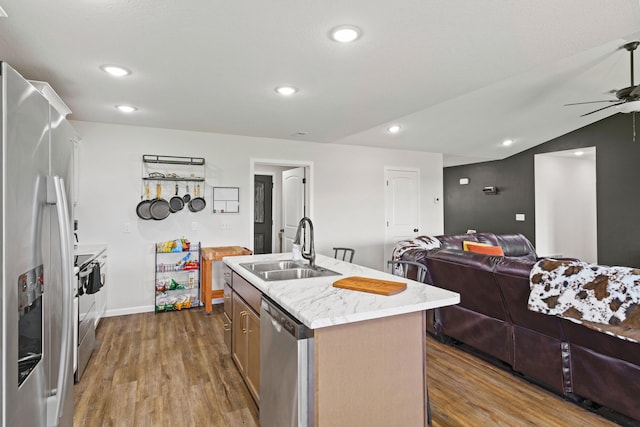 506 Addie Ln, Centralia, MO 65240 - kitchen featuring stainless steel appliances, open floor plan, a ceiling fan, dark wood-type flooring, and a center island with sink