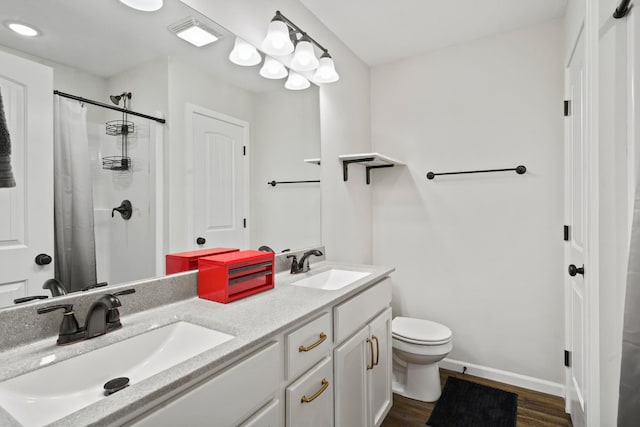 506 Addie Ln, Centralia, MO 65240 - full bathroom with double vanity, wood finished floors, and a shower with curtain