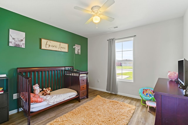 506 Addie Ln, Centralia, MO 65240 - bedroom featuring wood finished floors and ceiling fan