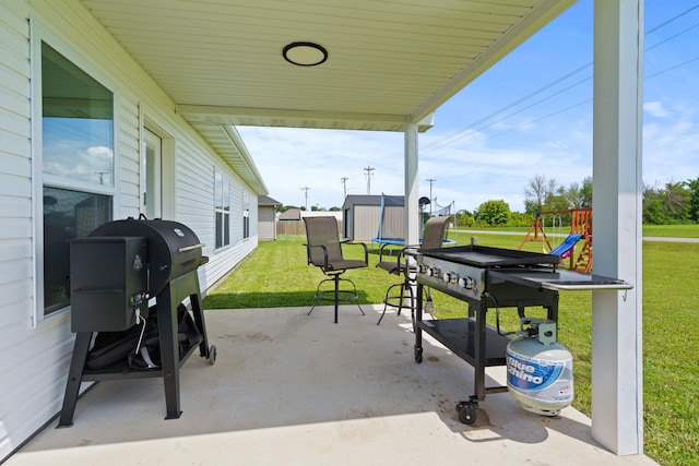 506 Addie Ln, Centralia, MO 65240 - view of patio / terrace with a shed and a playground