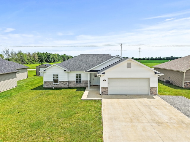 506 Addie Ln, Centralia, MO 65240 - view of front of property with concrete driveway, a garage, a front yard, stone siding, and a shingled roof