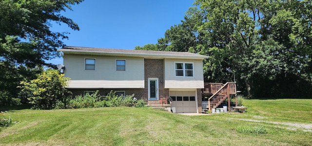 6501 W O B Brown Rd, Columbia, MO 65202 - rear view of property with brick siding, a garage, stairway, a yard, and a wooden deck