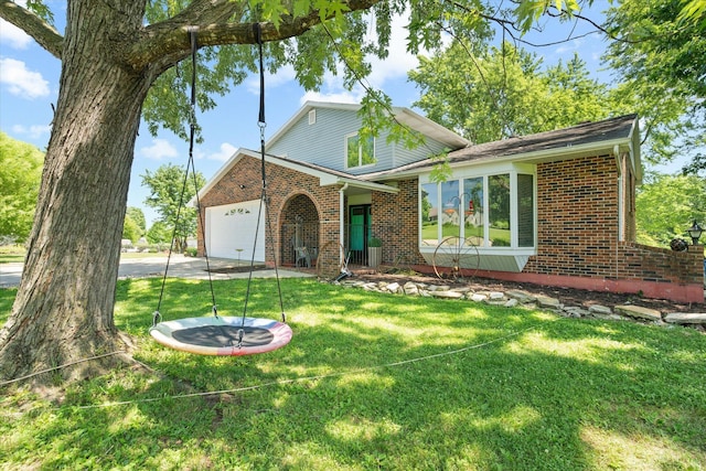 133 Manview Ln, Holts Summit, MO 65043 - tri-level home featuring brick siding, an attached garage, and a front yard