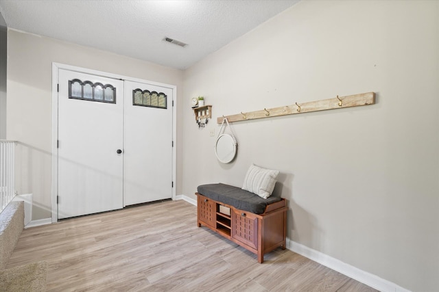 133 Manview Ln, Holts Summit, MO 65043 - entryway with light wood finished floors and a textured ceiling