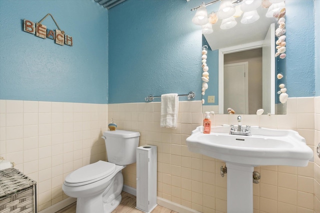 133 Manview Ln, Holts Summit, MO 65043 - bathroom with tile walls and a wainscoted wall