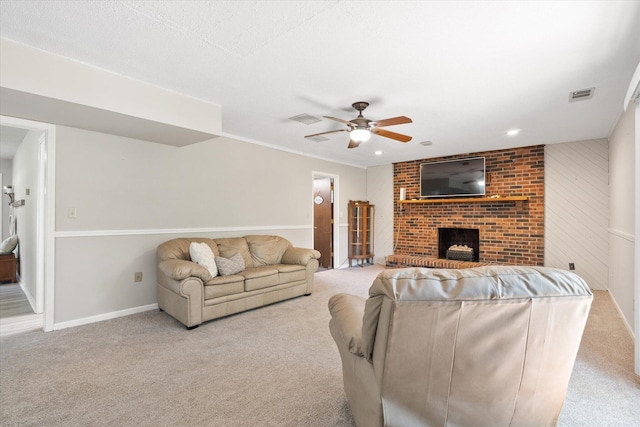 133 Manview Ln, Holts Summit, MO 65043 - carpeted living room featuring a brick fireplace and a ceiling fan