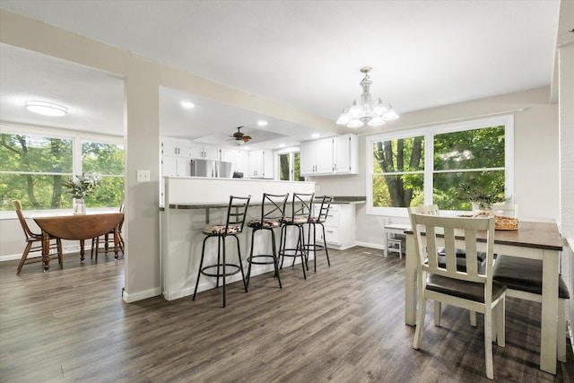 133 Manview Ln, Holts Summit, MO 65043 - dining room with dark wood-style floors, a chandelier, plenty of natural light, and recessed lighting