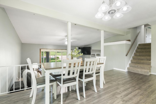 133 Manview Ln, Holts Summit, MO 65043 - dining area featuring wood finished floors, stairway, a ceiling fan, lofted ceiling, and a chandelier