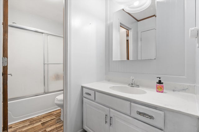 133 Manview Ln, Holts Summit, MO 65043 - full bathroom featuring vanity, wood finished floors, and shower / bath combination with glass door