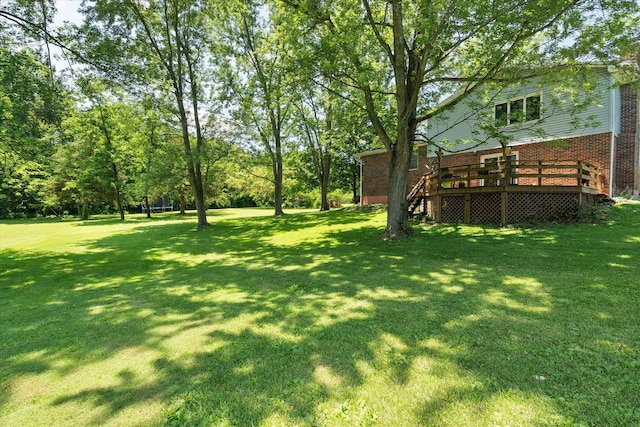 133 Manview Ln, Holts Summit, MO 65043 - view of grassy yard with a wooden deck and stairs