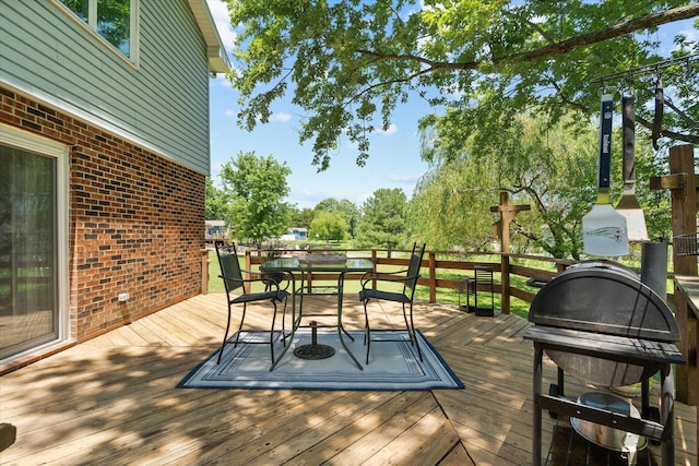 133 Manview Ln, Holts Summit, MO 65043 - wooden terrace with outdoor dining space and a grill