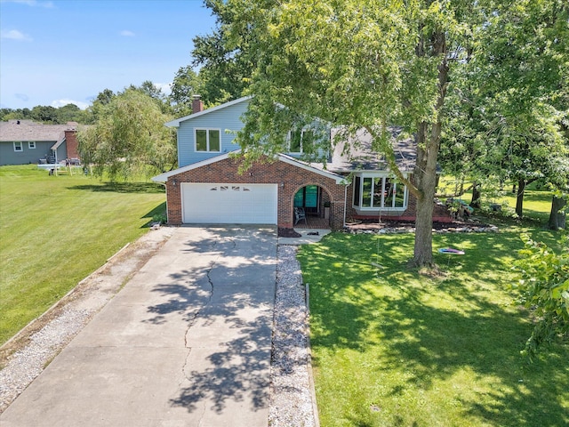 133 Manview Ln, Holts Summit, MO 65043 - view of front of property featuring brick siding, a garage, driveway, and a front lawn