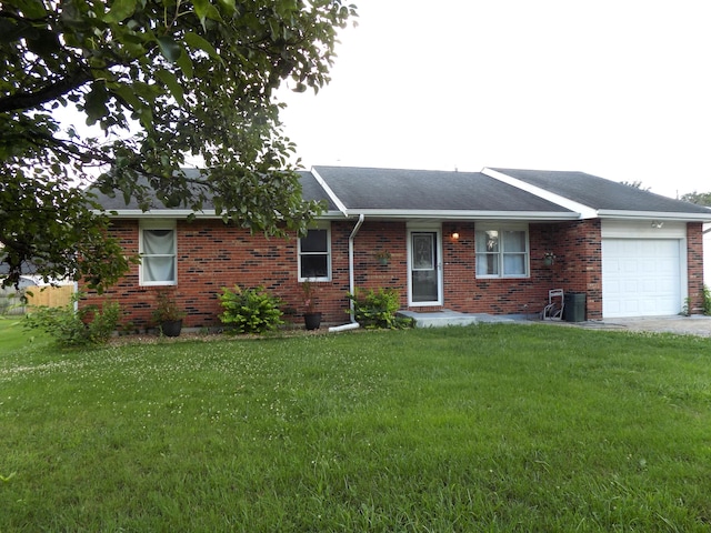 1008 Fairview St, Centralia, MO 65240 - ranch-style house with an attached garage, brick siding, a front lawn, and roof with shingles