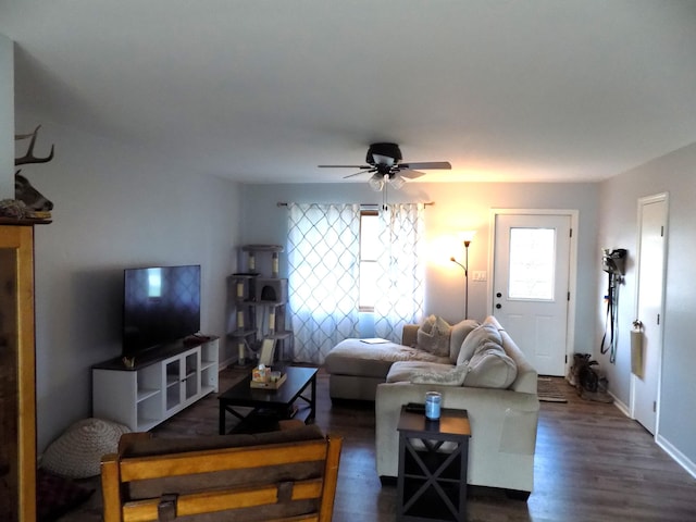 1008 Fairview St, Centralia, MO 65240 - living room featuring a ceiling fan and dark wood-type flooring