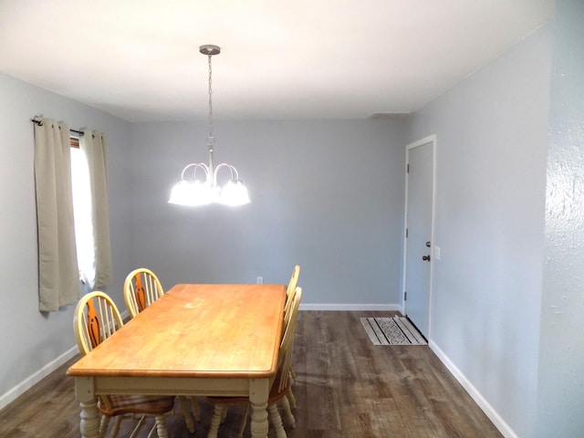 1008 Fairview St, Centralia, MO 65240 - dining space with wood finished floors and a chandelier