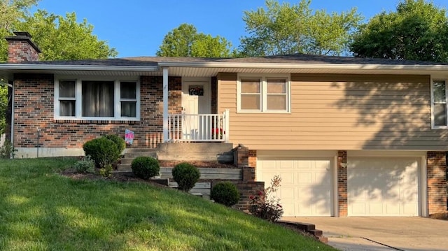 1409 E Lexington Cir, Columbia, MO 65203 - view of front facade with brick siding, a garage, concrete driveway, a chimney, and a front lawn