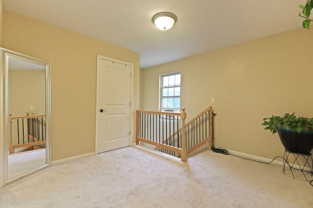 4241 E Ketterer Rd, Columbia, MO 65202 - corridor featuring an upstairs landing and carpet