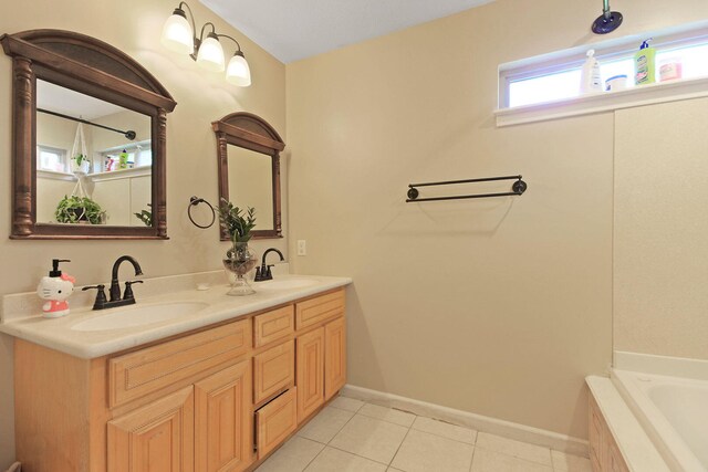 4241 E Ketterer Rd, Columbia, MO 65202 - bathroom featuring double vanity, tile patterned flooring, and tiled tub