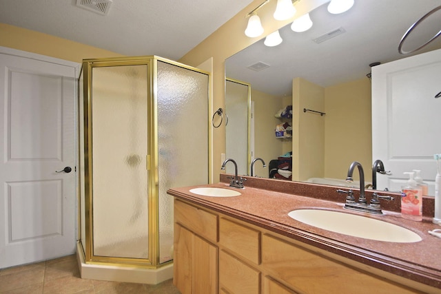 4241 E Ketterer Rd, Columbia, MO 65202 - full bathroom with a stall shower, double vanity, and tile patterned floors
