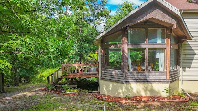 4241 E Ketterer Rd, Columbia, MO 65202 - view of side of property with a sunroom and a wooden deck