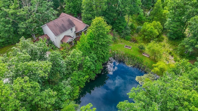 4241 E Ketterer Rd, Columbia, MO 65202 - aerial view of property and surrounding area featuring a large body of water and a heavily wooded area